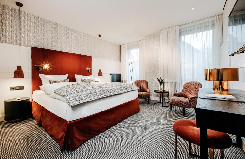 Postel nebo postele na pokoji v ubytování Hotel am Ochsentor