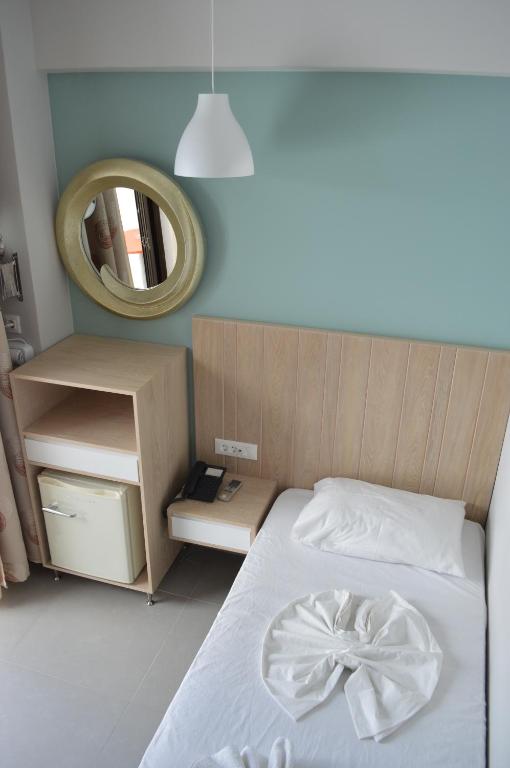 Postel nebo postele na pokoji v ubytování Catherine Hotel