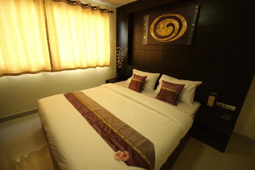 Postel nebo postele na pokoji v ubytování Regent Suvarnabhumi Hotel