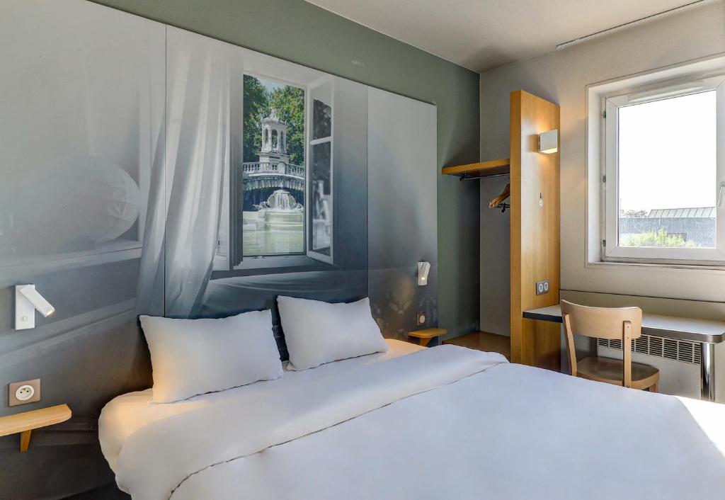 Postel nebo postele na pokoji v ubytování B&B HOTEL Dijon Nord Zénith