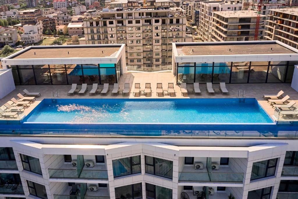 a swimming pool on top of a building at TGM Sunrise View - Infinity Pool & Spa Resort in Mamaia Nord