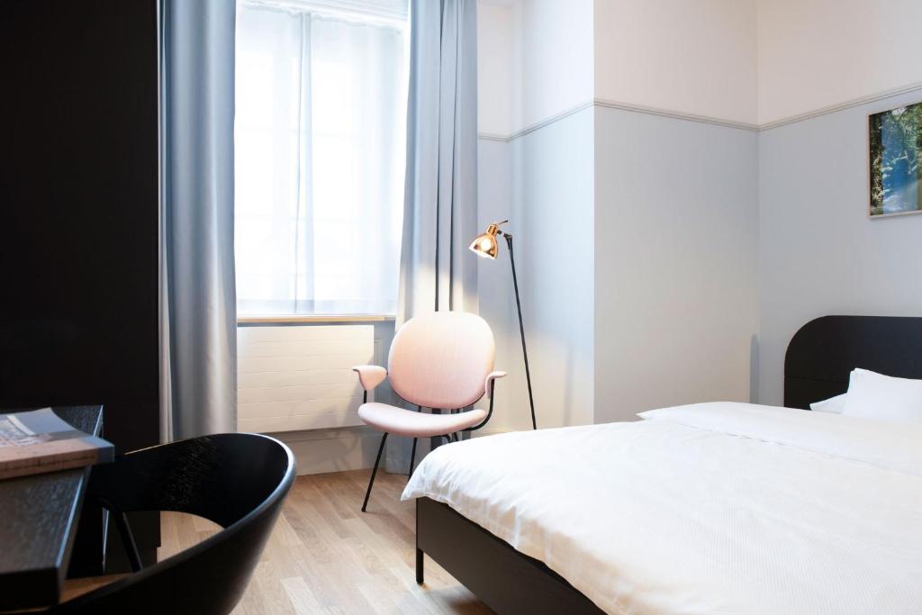 Postel nebo postele na pokoji v ubytování Hotel Schützen Rheinfelden