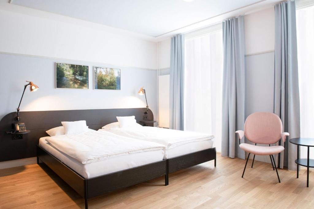 Postel nebo postele na pokoji v ubytování Hotel Schützen Rheinfelden
