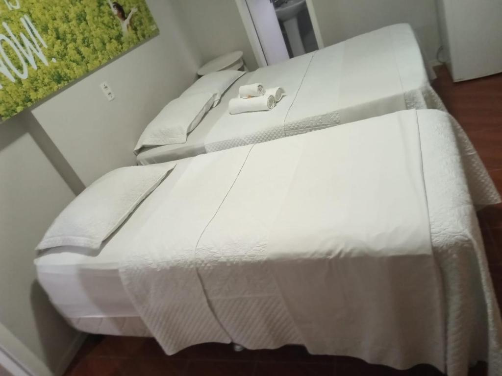 Giường trong phòng chung tại POUSADA AREIA DA PRAIA