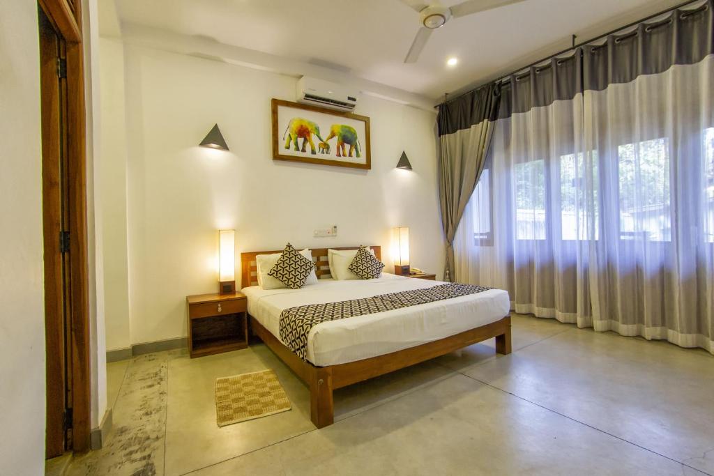 Postel nebo postele na pokoji v ubytování Hotel Athgira