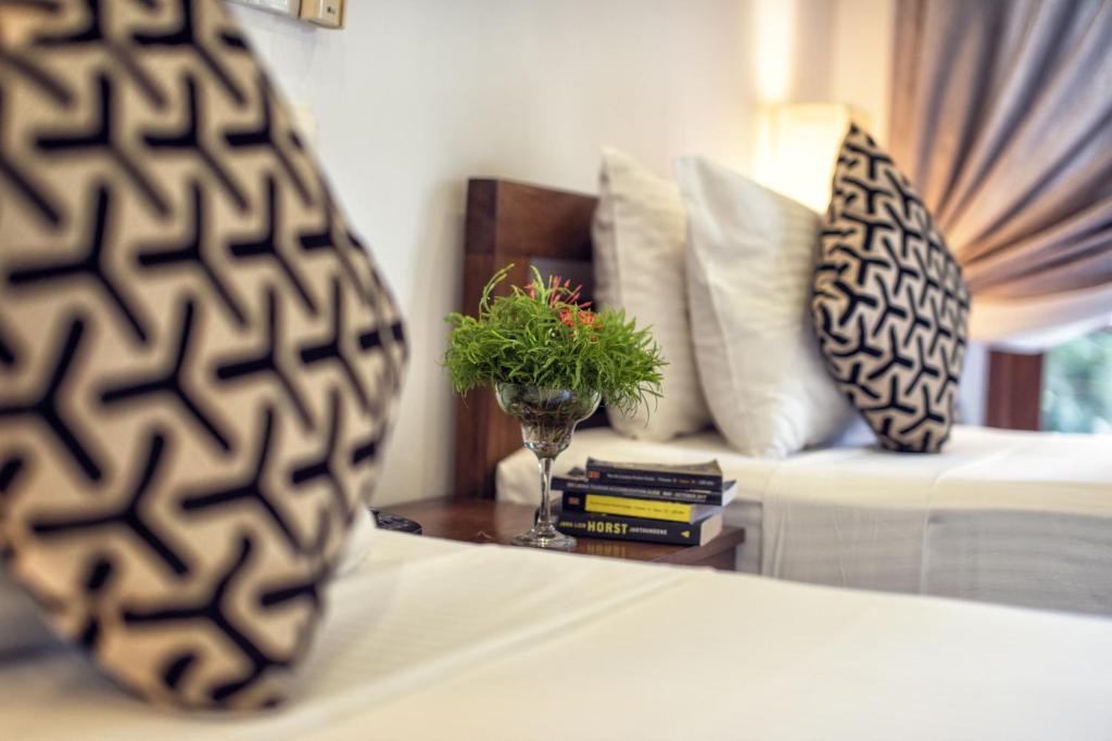 Postel nebo postele na pokoji v ubytování Hotel Athgira