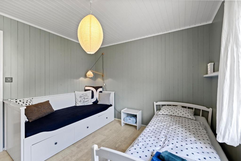 A bed or beds in a room at Sunny Design Chalet in Engelberg with spectacular view on Mount Titlis