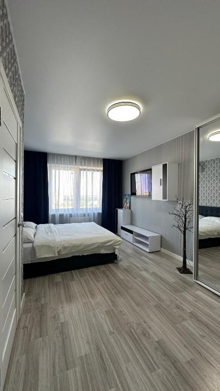 Кровать или кровати в номере Є генератор 1кім Осокорки вул Бориса гмирі 20 ЖК Патріотика