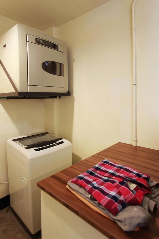 Kuchyň nebo kuchyňský kout v ubytování Backpackers Hostel - Ximen