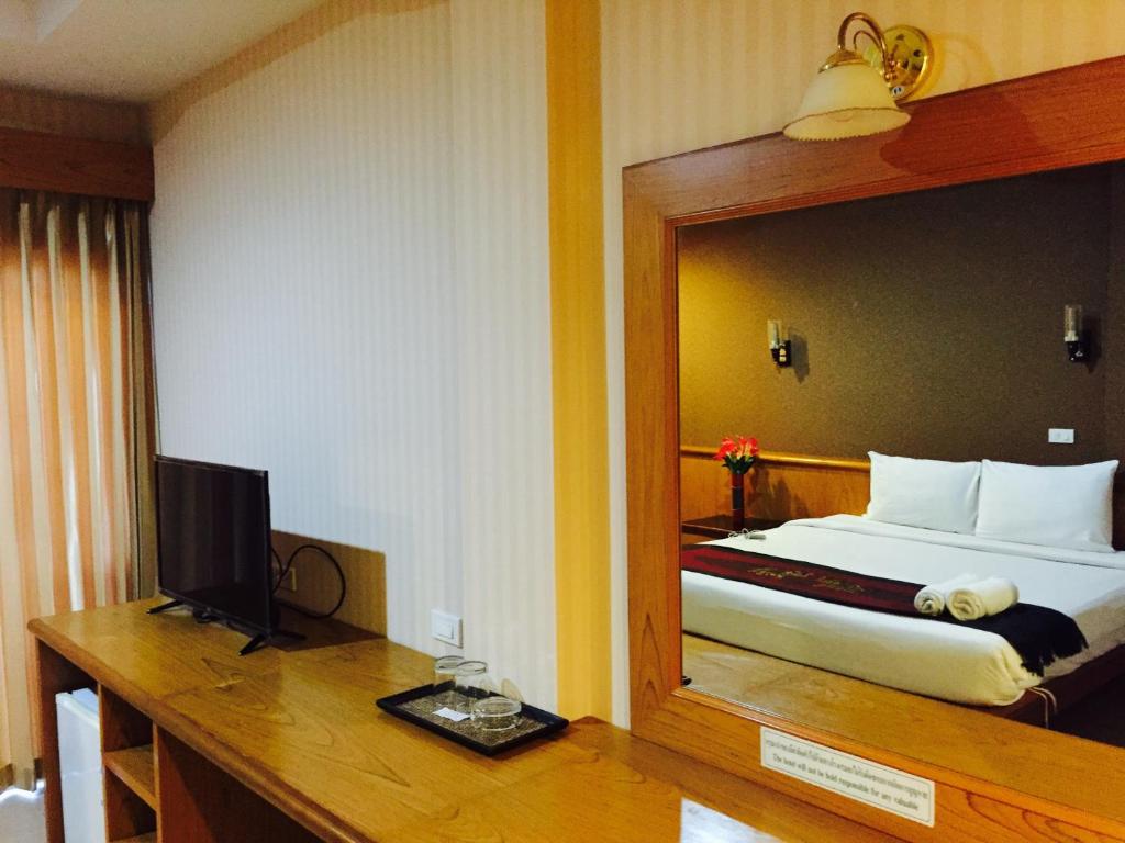 Postel nebo postele na pokoji v ubytování Natural Samui Hotel