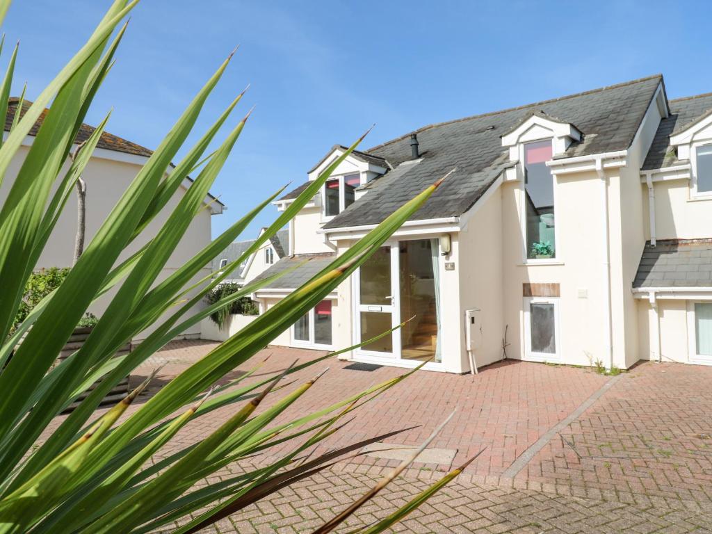 an exterior view of a house with a driveway at The Beach House in Newquay