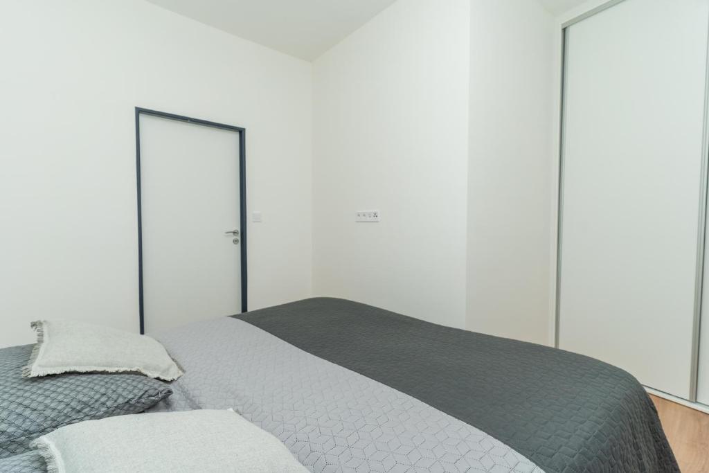Posteľ alebo postele v izbe v ubytovaní Apartmány KRAKENS