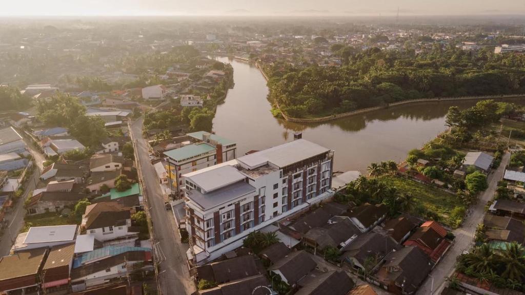 an aerial view of a city with a river at River Hotel Pattani in Pattani