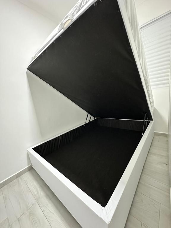 a black and white drawer in a white room at Hotel Aeroporto Congonhas 4 in Sao Paulo