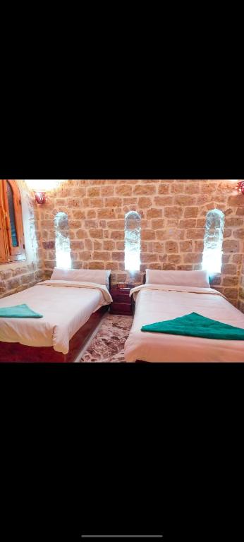 Postel nebo postele na pokoji v ubytování Pidgeon Lodge - Tunis Village