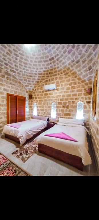 Postel nebo postele na pokoji v ubytování Pidgeon Lodge - Tunis Village