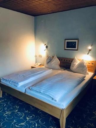 Postel nebo postele na pokoji v ubytování Hotel Daneu Gaschurn