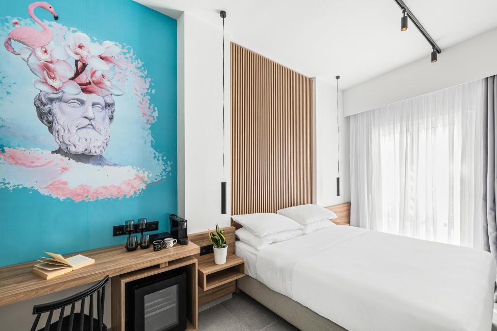 Postel nebo postele na pokoji v ubytování The Q Hotel