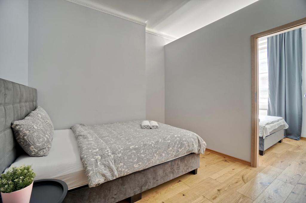 Posteľ alebo postele v izbe v ubytovaní Warsaw Premium Apartments Deluxe Old Town