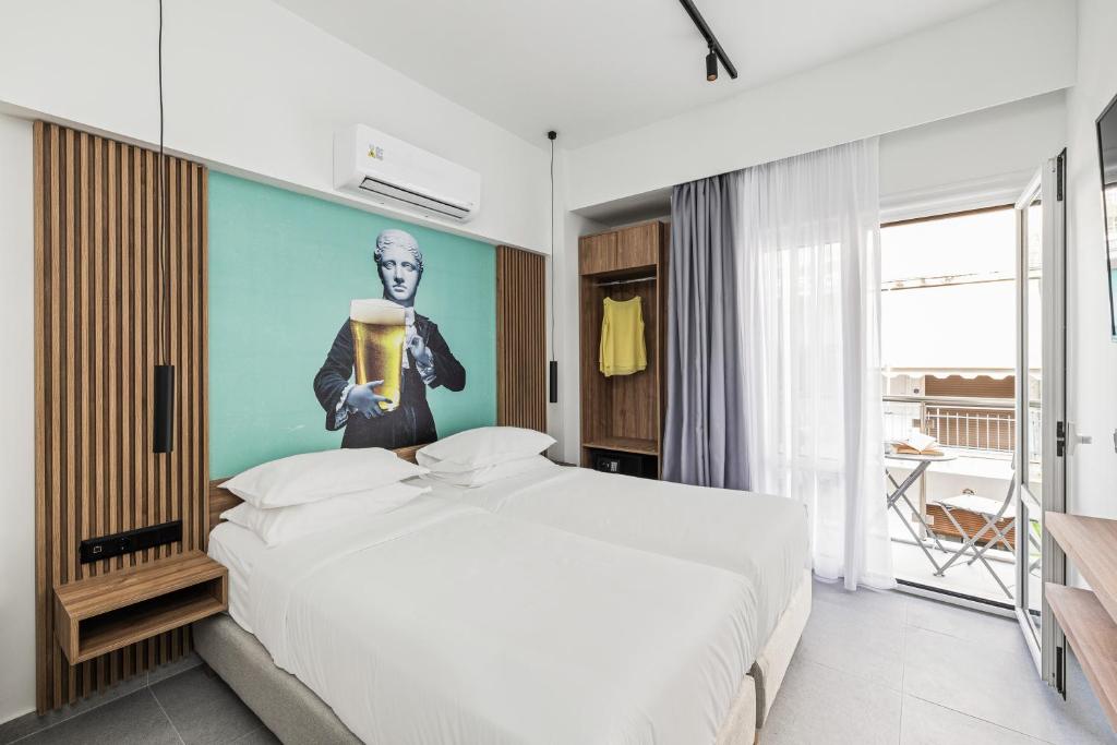 Postel nebo postele na pokoji v ubytování The Q Hotel
