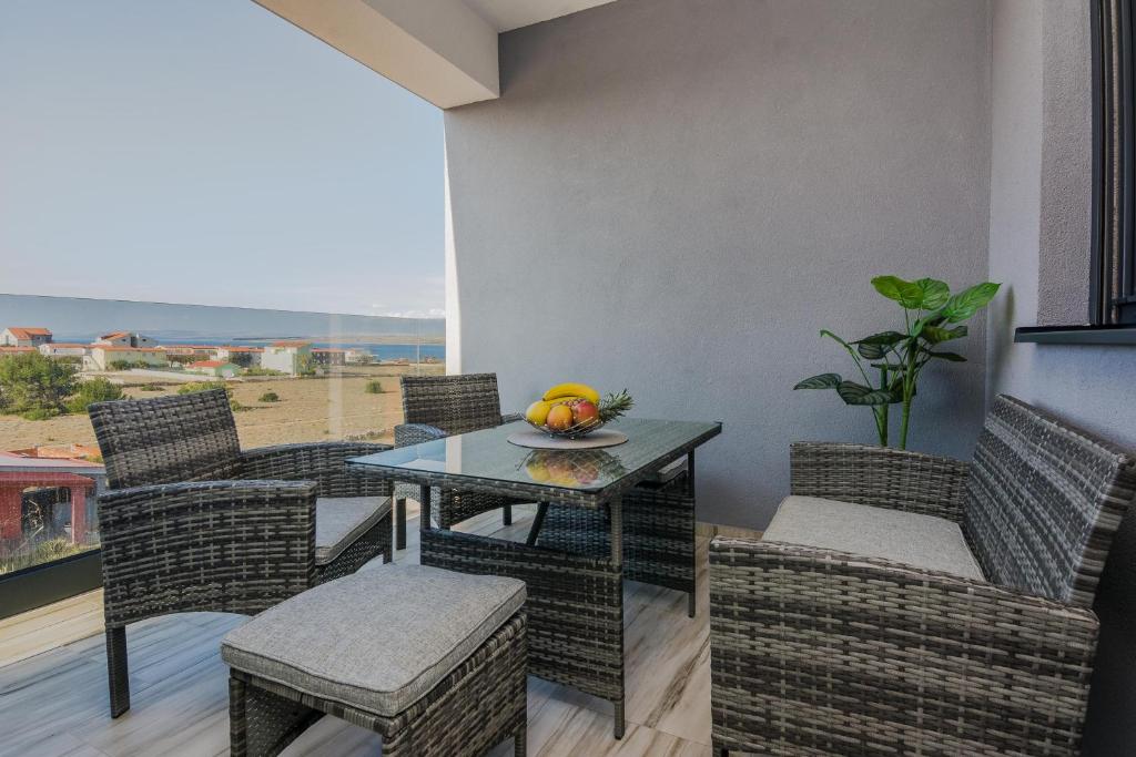 a dining room with a table and chairs with a view at Seaview apartments Glamour Vir - by TA Leut Agency in Vir