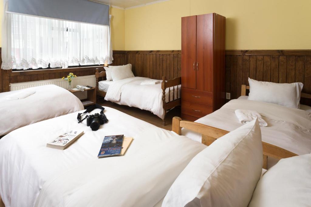 Postel nebo postele na pokoji v ubytování Hostal Hielo Sur