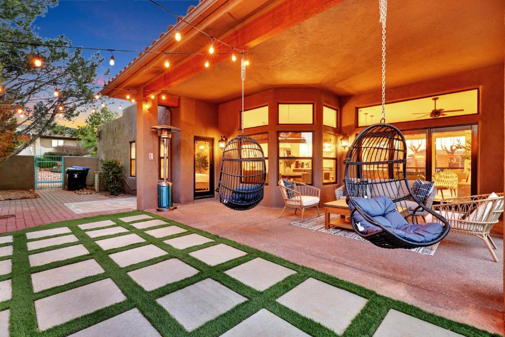 a house with two swings on a patio at Three Bedroom, Amazing Views, Hot Tub and Pets Allowed, Close to Chapel of the Holy Cross and Chapel Hill, less than 1mi to Trailheads in Sedona