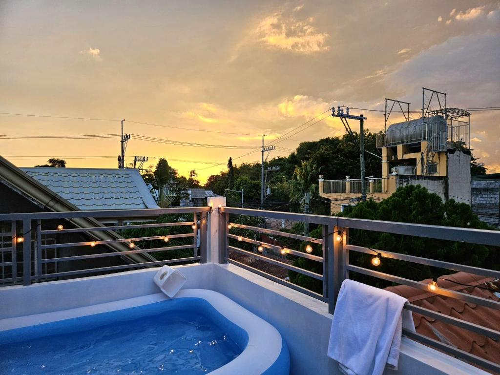 a hot tub on the balcony of a building at Mountain View in Binangonan