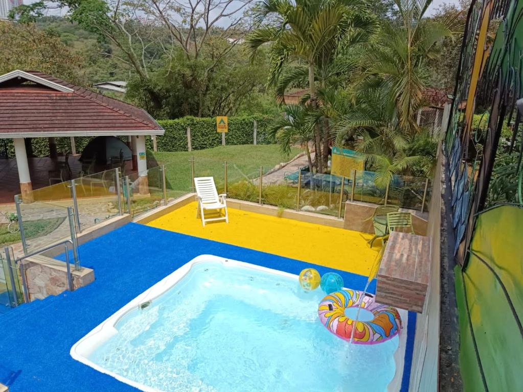 a small swimming pool with an inflatable at Hotel Palmera Real in Bucaramanga