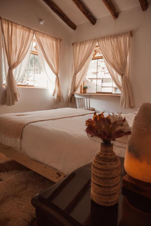 Postel nebo postele na pokoji v ubytování Casa Faustina - Pisac