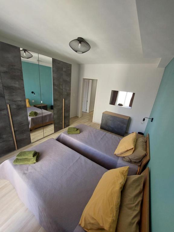Postel nebo postele na pokoji v ubytování Serenity Apartment