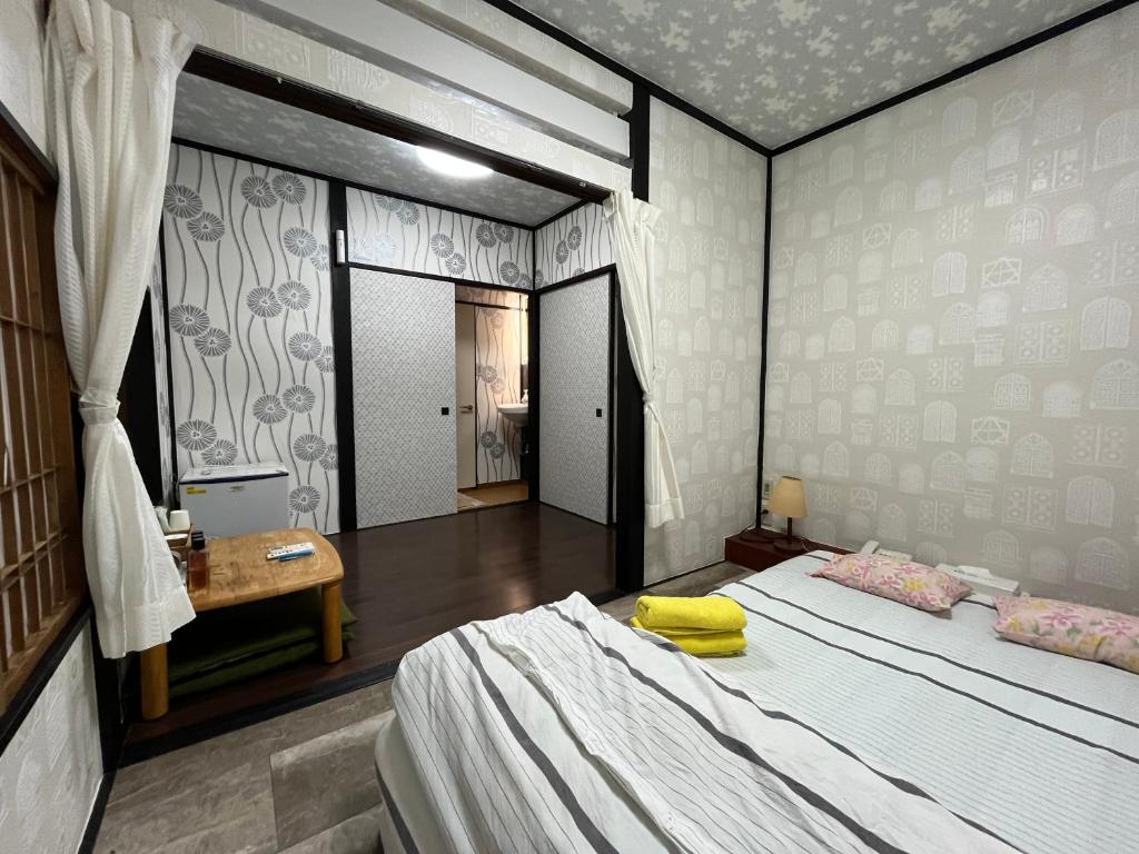 Postel nebo postele na pokoji v ubytování Lucky Hotel