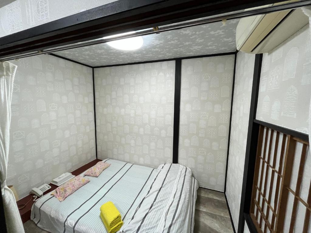 Postel nebo postele na pokoji v ubytování Lucky Hotel
