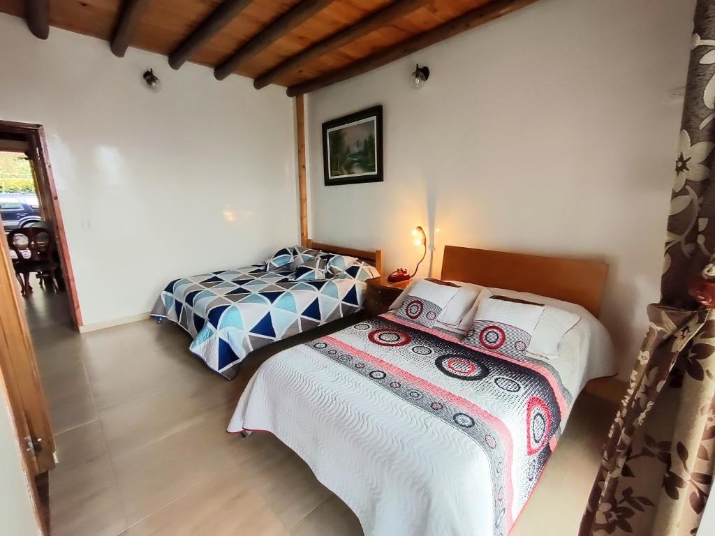 Postel nebo postele na pokoji v ubytování Finca El Mirador Subachoque