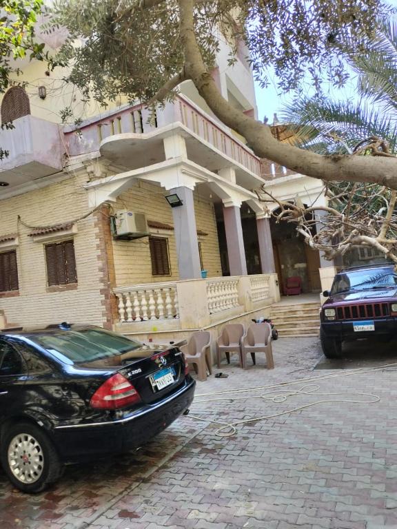 a black car parked in front of a building at Giza view in Cairo