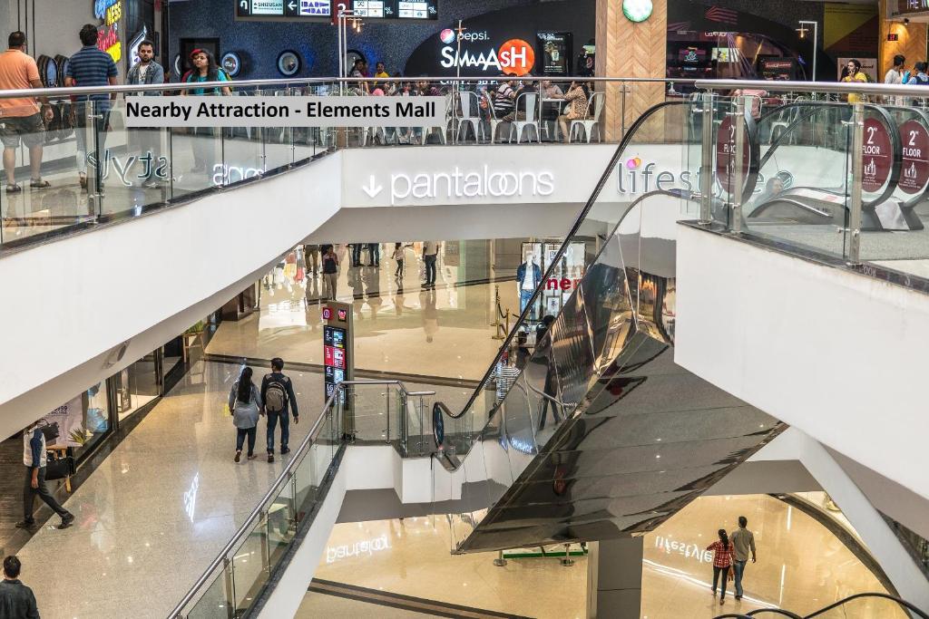 a view of a shopping mall with people walking through it at Collection O Tip Top in Jaipur