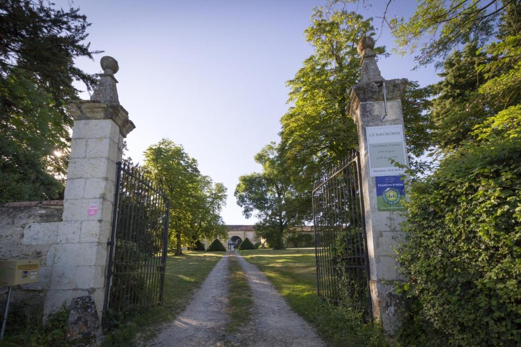 an iron gate at the entrance to a garden at Le Gavachon in Leboulin