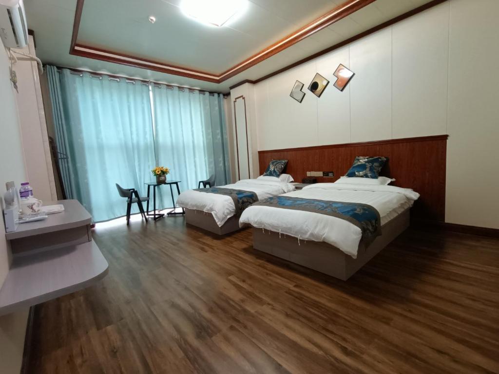 Postel nebo postele na pokoji v ubytování Meizhou Cloudy B&B
