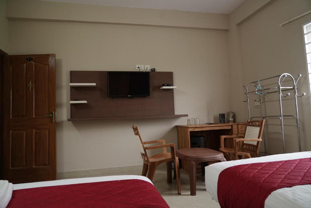 Postel nebo postele na pokoji v ubytování DREAMS AIRPORT RESIDENCY