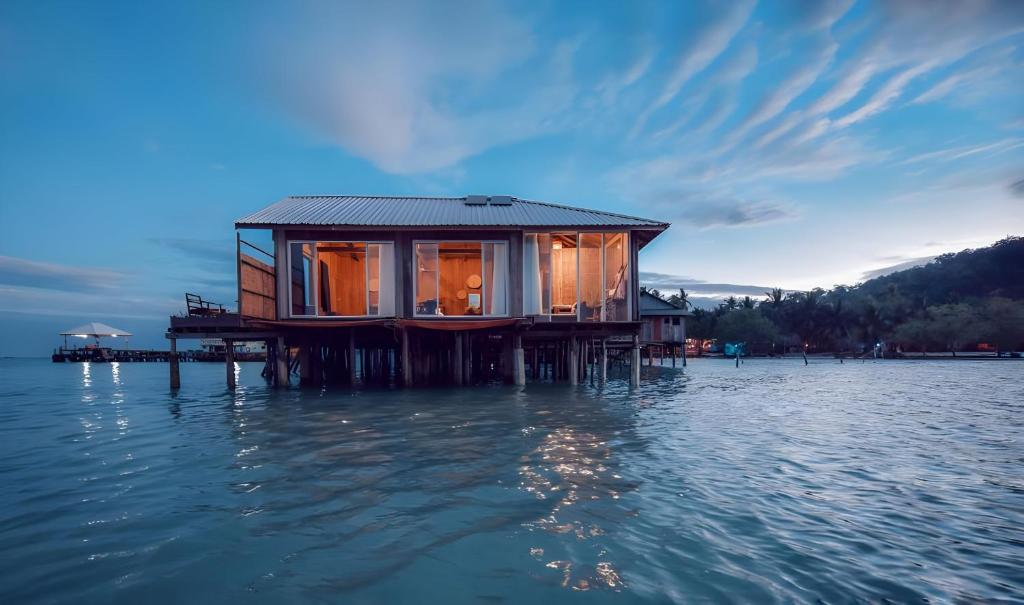 a house on a dock in the water at Salacia's Suite in Koh Rong Island