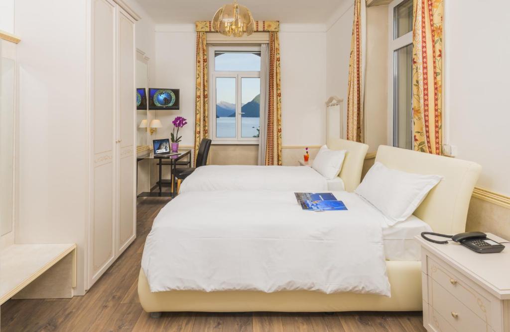 Postel nebo postele na pokoji v ubytování Hotel Victoria