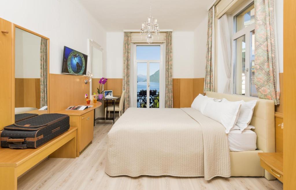 Postel nebo postele na pokoji v ubytování Hotel Victoria