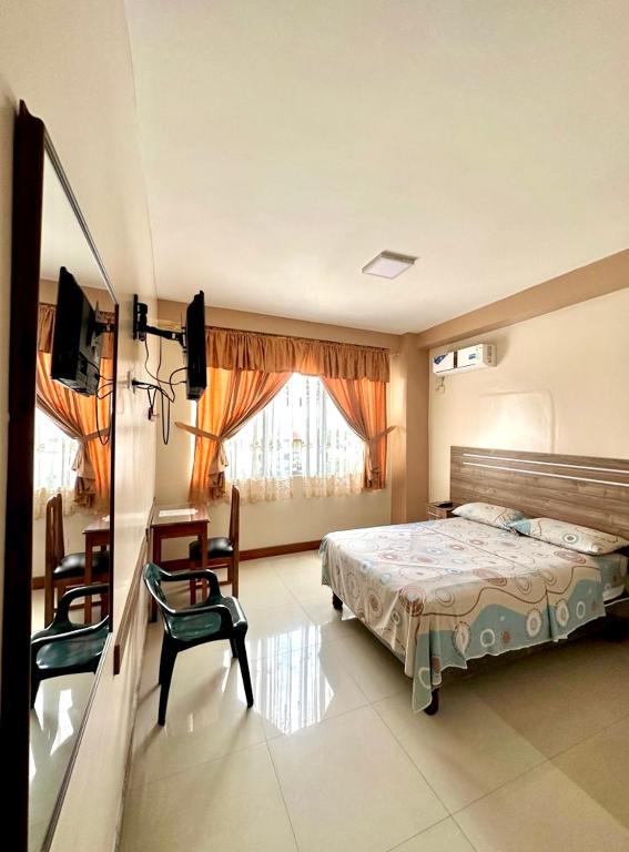Postel nebo postele na pokoji v ubytování Hotel Zulema Inn