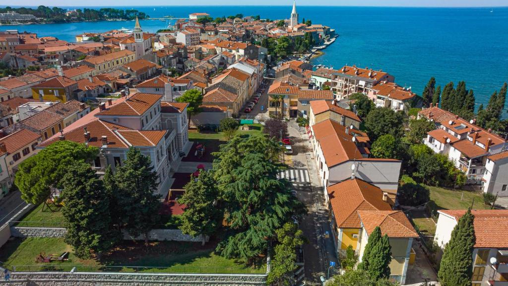 an aerial view of a town next to the ocean at Valnea - apartment for five people in the center of Poreč in Poreč