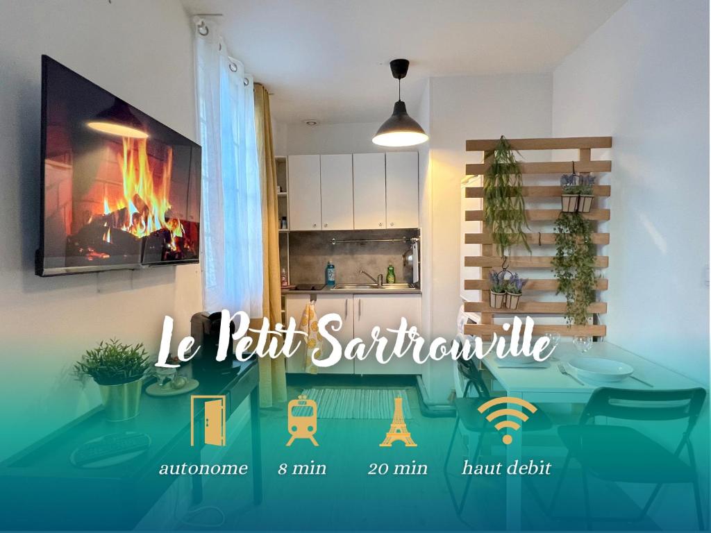 uma cozinha com uma mesa com uma lareira em Le petit Sartrouville à 20 min de Paris en RER A em Sartrouville