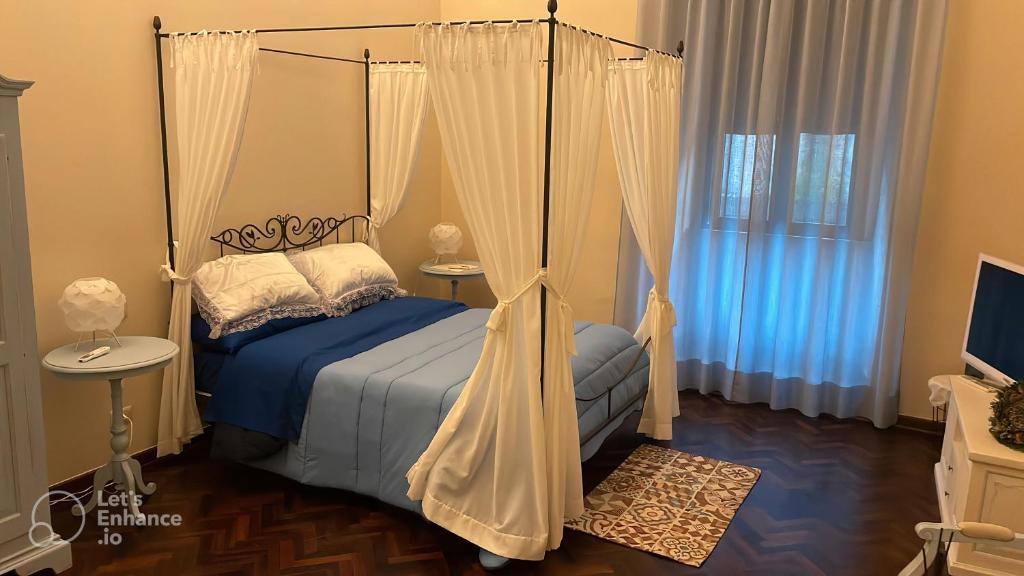 Postel nebo postele na pokoji v ubytování La Loggia del Mercante