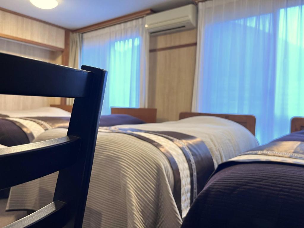 Postel nebo postele na pokoji v ubytování Fukiya
