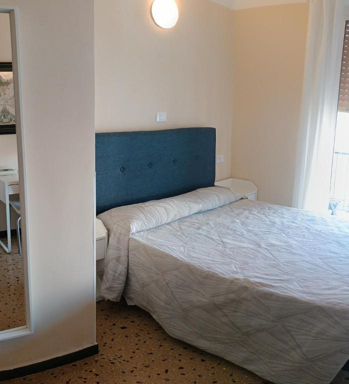 Łóżko lub łóżka w pokoju w obiekcie Hotel Elisabetta