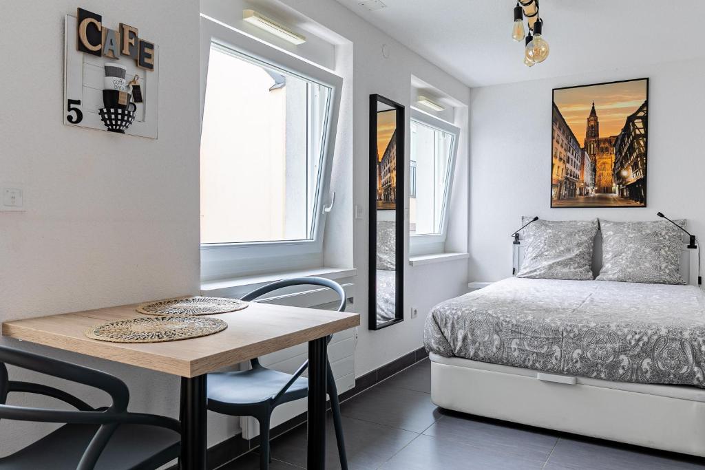 Ένα ή περισσότερα κρεβάτια σε δωμάτιο στο Résidence le premium, hyper centre, studio tout équipé