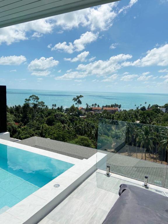 a view of the ocean from a house at duplex 2 bedroom sea view villa with private pool in Koh Samui